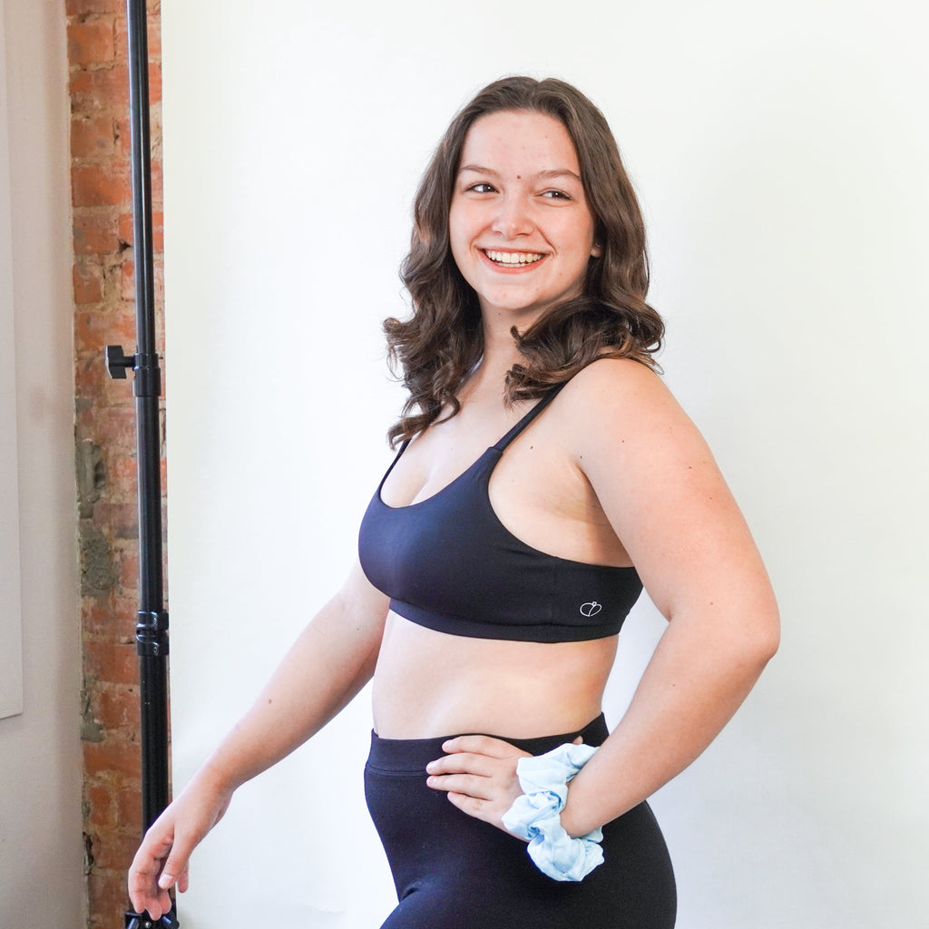 apricotton artemis sports bra model standing side