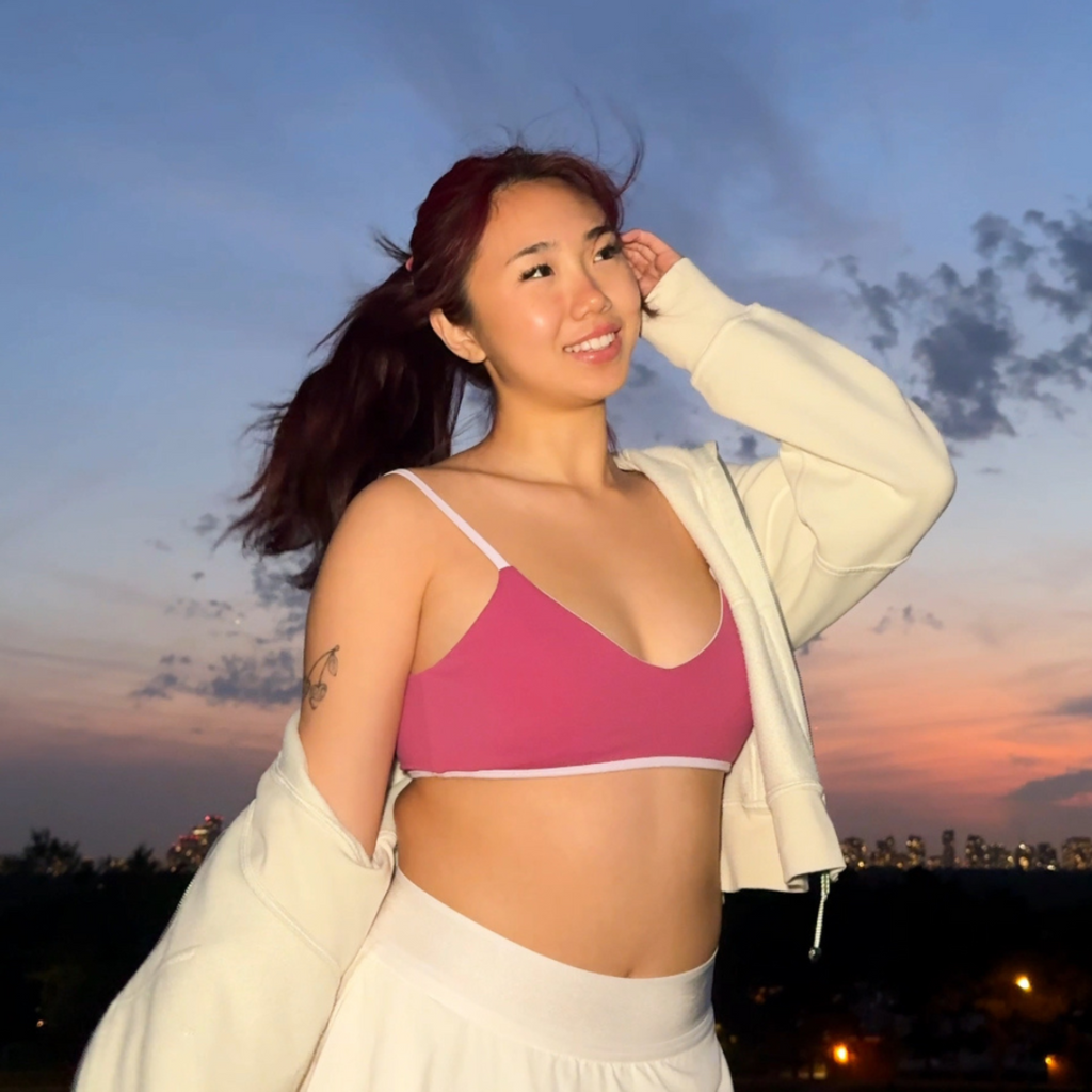 apricotton aurora reversible bra model standing front sunset