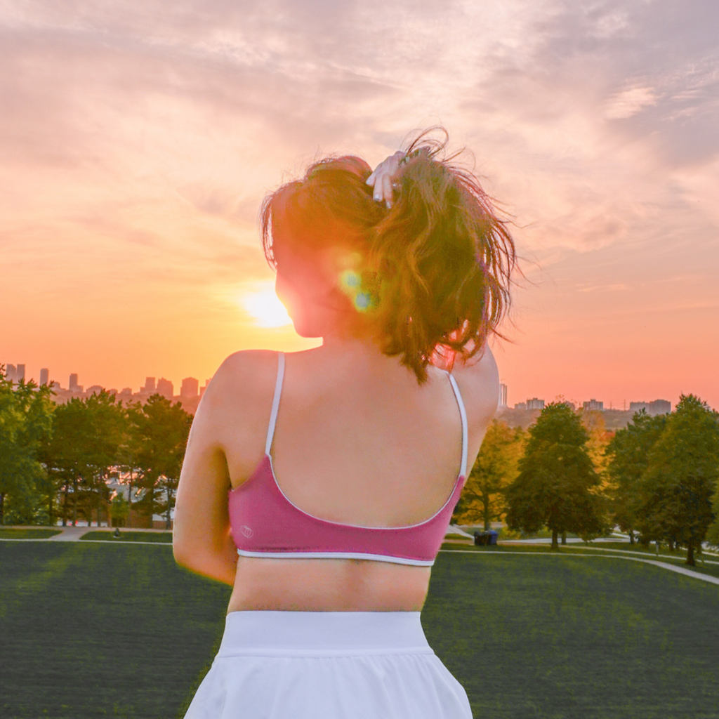 apricotton aurora reversible bra model standing back sunset